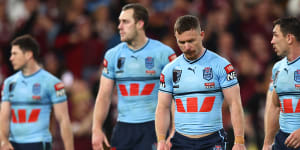 Dejected Blues players after losing this year’s series at Suncorp Stadium.