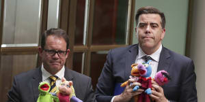 Luke Gosling and Milton Dick leave the chamber under 94a for bringing Muppets into Question Time.