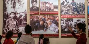 Children learn the life story of their leader,Xi Jinping,at the Museum of the Chinese Communist Party in Beijing in October.