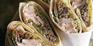 Shows spicy chicken wraps with cracked wheat and tomato salad