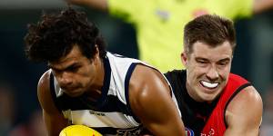 Bombers captain lays a tackle on Lawson Humphries.