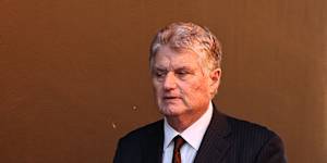 ATC chairman Peter McGauran leaves the meeting of members at Randwick racecourse on Tuesday.