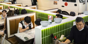 Cantonese traffic signs and a retired minibus help recreate a Kowloon streetscape.