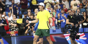 Alex de Minaur celebrates his win over Novak Djokovic.
