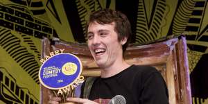 Sam Campbell in 2018,accepting his Barry Award for the most outstanding comedy act at the Melbourne International Comedy Festival.