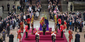 Members of the public file past as King Charles III,Anne,Princess Royal,Prince Andrew,Duke of York and Prince Edward,Earl of Wessex hold a vigil beside the coffin of their mother,Queen Elizabeth II.
