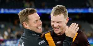 Winners are grinners:Hawthorn coach Sam Mitchell and skipper James Sicily.