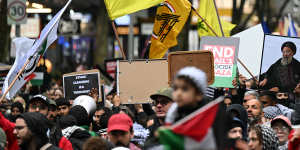 A Hezbollah flag at a pro-Palestine rally outside the State Library of Victoria on Sunday.