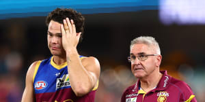 Cam Rayner and Chris Fagan leave the field after the Brisbane Lions’ clash with Melbourne.