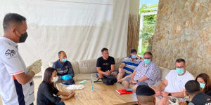 Police speak with Shane Warne’s friends on Saturday morning at Samujana Villas in Koh Samui.
