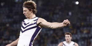 Nat Fyfe of the Dockers kicks for goal during the round 19 AFL match between the Richmond Tigers and the Fremantle Dockers.