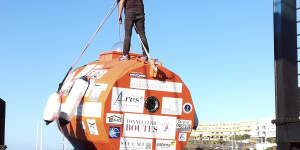 Jean-Jacques Savin,pictured in 2018 atop the barrel he previously used to cross the Atlantic.