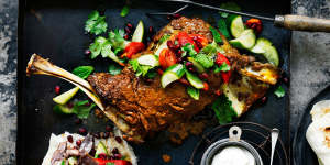 Lamb shoulder with tahini yoghurt,pickled cucumbers,pomegranate and herbs.