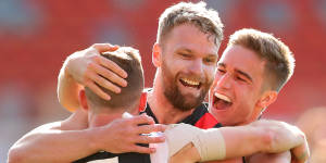 Devon Smith,Jake Stringer,and Matt Guelfi celebrate a key goal.