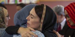 Jacinda Ardern comforts a member of Christchurch's Muslim community just after the attack.