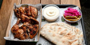 Whole chicken plate with pickles,pita and toum (tangy garlic sauce).