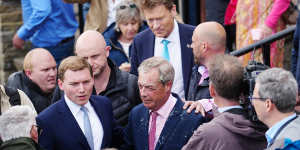 Reform UK party leader Nigel Farage was drenched after a woman threw a milkshake over him on Tuesday.