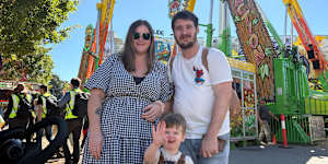 Logan family Ashlee and Mitchell Harris with their son Henry at the Ekka on Tuesday morning.