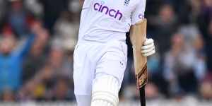 Joe Root,having made a century and passed 10,000 Test runs,celebrates the win. 