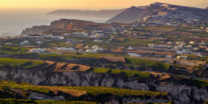 Fields,vineyards and the villages of Fira and Oia,Santorini,Greece.