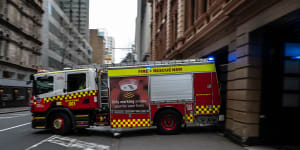 Man dies in Sydney house fire after rushing upstairs with extinguisher