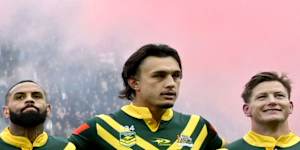 Daniel Jarvis links arms with Munster during the Australian national anthem.