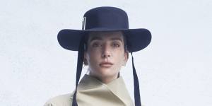 Dior trench coat,$6900. Roger Vivier “Très Vivier” hat,$1210,and “Belle Vivier” boots,$2590. 