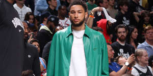Courtside in matching Prada jacket and shorts. Simmons has been called a “style icon” as well as “looking like Zoolander”.