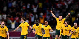 An elated Aaron Mooy jumps for joy after Australia beat Peru to reach the World Cup finals.