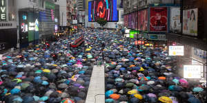 Tens of thousands of demonstrators march during a protest in the Causeway Bay district of Hong Kong,China,on Sunday.