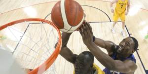 Duop Reath (left) battles USA’s Bam Adebayo in the Olympics warm-up match this week.