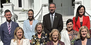 Queensland’s reshuffled ministers (left to right,from back row):Mark Bailey,Meaghan Scanlon,Craig Crawford,Leanne Linard;Yvette D’Ath,Leeanne Enoch,Di Farmer;Premier Annastacia Palaszczuk,Governor Jeannette Young,Shannon Fentiman.