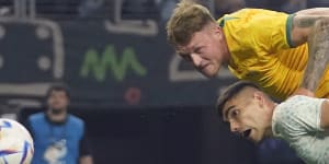 Harry Souttar heads past Johan Vasquez to score Australia’s first goal.