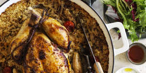 Roast chicken on baked rice with tomato,cumin and bay.