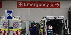 Ambulance paramedics at the Nepean Hospital cleaning and restocking vehicles in preparation for a call on Sunday.