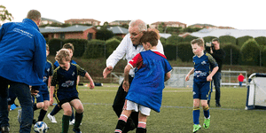 Scott Morrison trips into child on the field whilst playing soccer at the Davenport Strikers Soccer Club in the seat of Braddon.