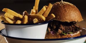 SYDNEY,AUSTRALIA - APRIL 09:Pulled pork burger with fries at The Public in Cammeray on April 9,2015 in Sydney,Australia. (Photo by Christopher Pearce/Fairfax Media)