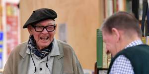 Treasured day out:Cartoonist and illustrator Vane Lindesay,96,left,chats with Merchant of Fairness bookshop owner Rod Cameron at South Melbourne Market,which is turning 150. 