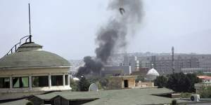 Smoke rises near the US embassy in Kabul on Sunday.