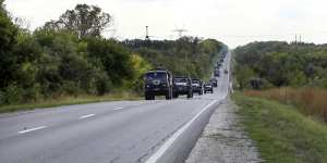 A Russian Defence photo shows Russian military vehicles driving in the direction of Kharkiv on Friday. The next day Russia announced troop withdrawals from the region.