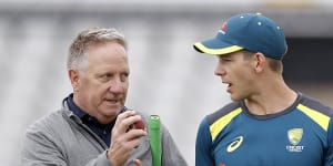 Former Australian wicketkeeper Ian Healy talks tactics with Tim Paine at Old Trafford.