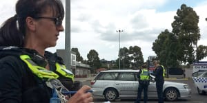 Victoria Police issue pandemic-related fines at a refugee rights protest in Preston earlier this year.