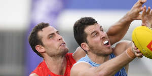 Spoiling effort:Gold Coast’s Jarrod Witts competes with Tristan Xerri.