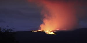 Lava pours out of the summit crater of Mauna Loa on Tuesday (AEDT).
