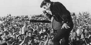 A young Elvis Presley heralded the explosion of rock and roll as the dominant form of popular music.