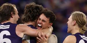 Jye Amiss celebrates a goal with David Mundy,Heath Chapman and Hayden Young. 