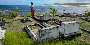 ‘This place will crack’:Centuries-old graves threatened by the sea