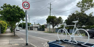 The ghost bike memorial on Nudgee Road at Hendra has reappeared on the back of a legally parked trailer. There is a “No Standing” sign pointing the other way,and a bicycle stencil on the road,but the trailer is in a legal parking space.