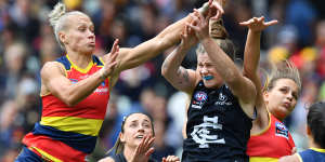 Erin Phillips of the Adelaide Crows and Brianna Davey of the Blues contest the ball during the AFLW Grand Final match. 