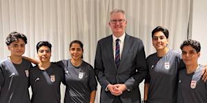 Minister for Home Affairs Tony Burke with five Iranian women soccer players who were granted asylum on Monday night. Some of the players have now left Australia.